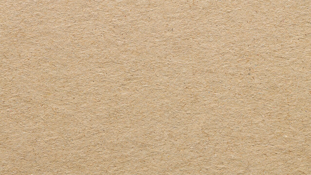 Natural beige kraft paper texture background with recycled fibrous surface for eco friendly backdrop