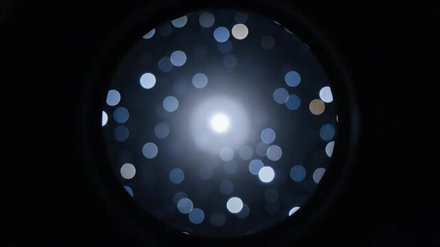 Central bank monetary policy abstract light bokeh circle glow dark blur starry night sky cosmic celestial astronomy cosmos nebula
