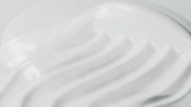 Extreme Close-Up of Combed White Cosmetic Cream Texture for Skincare Advertising.