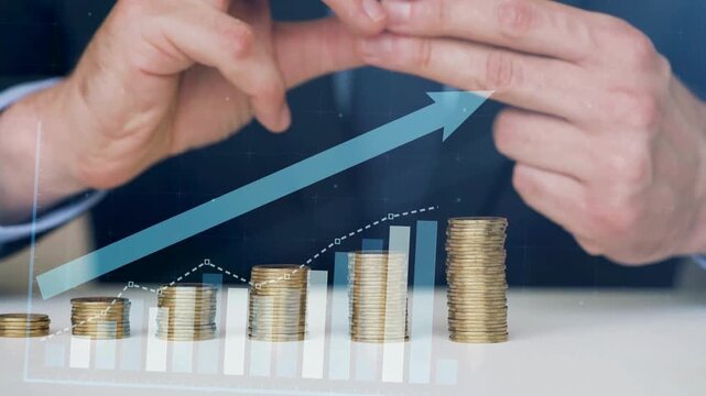 Businessman protecting growing stacks of coins with upward trending graph