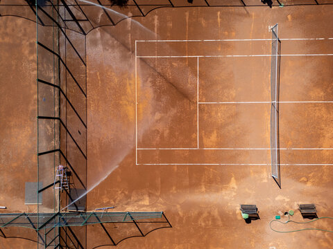 Aerial Top Down View of Clay Tennis Courts Maintenance, Camera Moving Forward