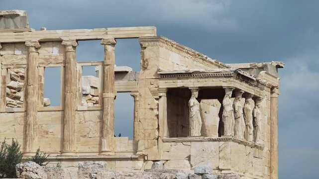 Caryatids, women figures statues at Erechtheion ancient Greek temple, on Acropolis hill. Cultural travel in Athens, Greece.