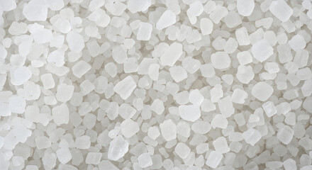 Plakat A close-up, detailed overhead view of coarse, white sea salt crystals, creating a textured background