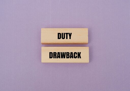 A wooden blocks with text DUTY DRAWBACK. A concept for international trade incentives, customs refunds, and tax relief strategies for export-import businesses