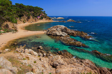 Fototapeta premium Secluded Cala Estreta Beach with Turquoise Waters, Costa Brava