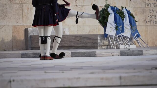 Evzoni guarding the presidential mansion in front of the tomb of the unknown soldier, army infantry in Athens, Greece, slow motion