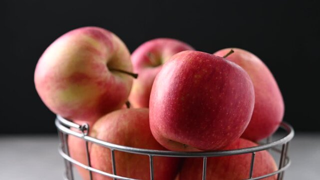 Fresh Red Apples Rotating on Black Background in Real Time