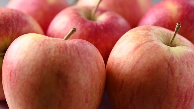 Fresh Red Apples Rotating on Black Background in Real Time