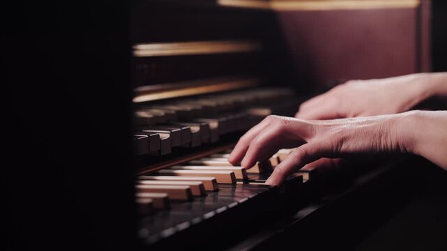 Close-Up Pianist Hands Playing Harpsichord Piano Keys in Warm Light