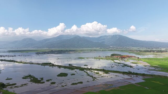 Aerial view of Rawa Pening is a natural lake in Semarang Regency, Central Java, located in the basin of the slopes of Mount Merbabu, Telomoyo, and Ungaran.