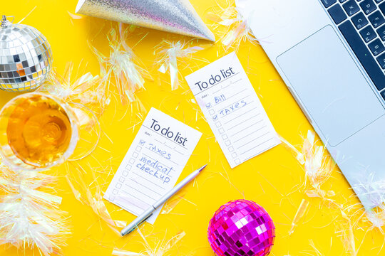 Work with fun. Laptop and to do lists with confetti and disco balls. Admin night party concept
