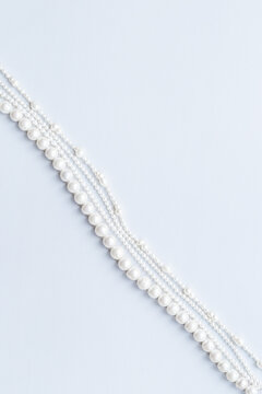Natural white baroque round pearls - beads for jewelry, top view. Gemstones background