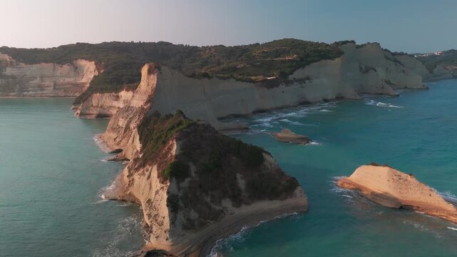 Cinematic Aerial Reveal of Cape Drastis Headland and White Coastal Cliffs in Corfu Greece