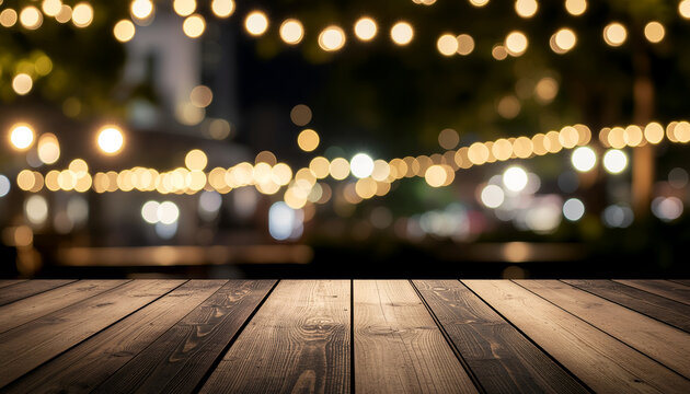 Wooden tabletop with festive bokeh lights at outdoor night gathering.