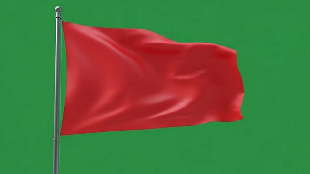 A plain red flag waves on a metal pole against a solid green background