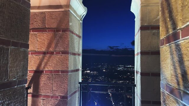 Night panoramic city view of Athens from Belfry of the St. George church on Lycabettus hill in Athens, Greece