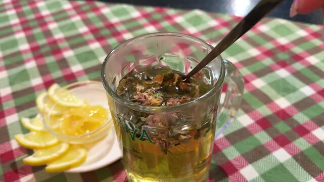 herbal tea and lemon honey wellness table with checkered cloth natural remedy scene 
