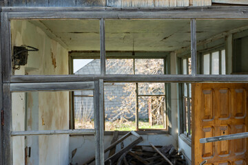 Abandoned House Interior Seen Through Broken Window © Olga Grivcova