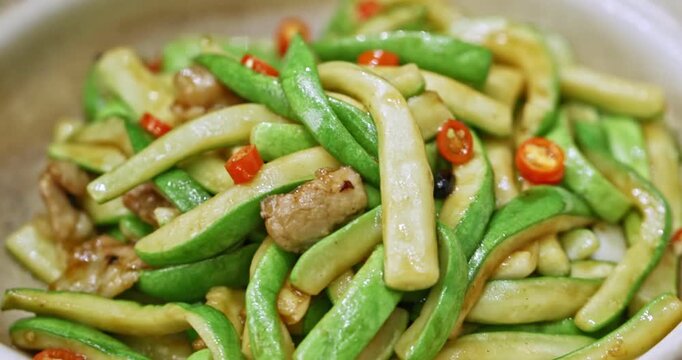 Classic casserole dish: Spicy pork belly with chili peppers and zucchini strips
