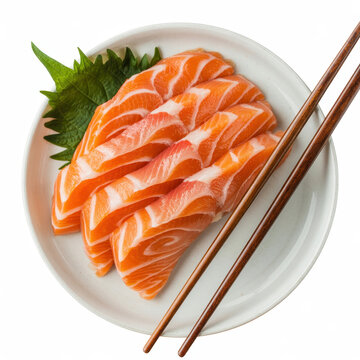 Fresh salmon sashimi slices on a white plate with a green shiso leaf and wooden chopsticks