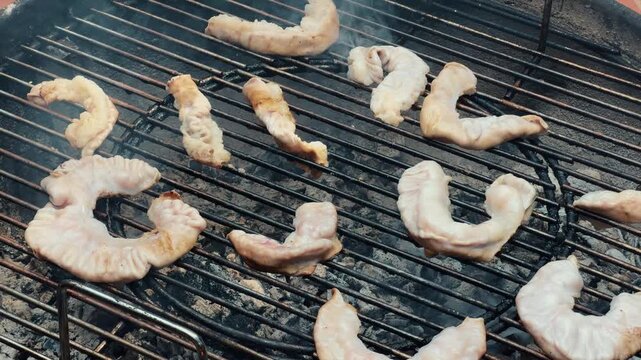 Grilled intestines to crispy texture. Chinchulin is the small intestine of an cow used in cooking, especially in Argentine, Uruguayan, and Paraguayan cuisine. High quality 4k footage