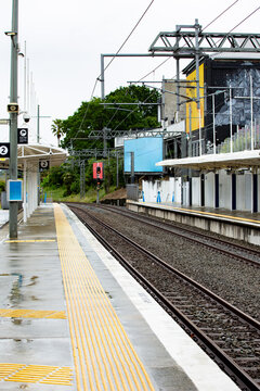 Train station platform soaked in the rain in Auckland, New Zealand