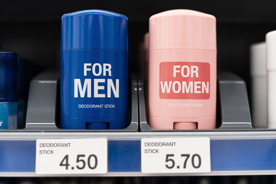 Gender-labeled deodorant sticks with unequal prices. Concept for pink tax in retail