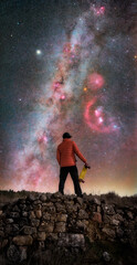Silhouette of Man Stargazing at Milky Way with Orion Constellation and Nebulae © Hector