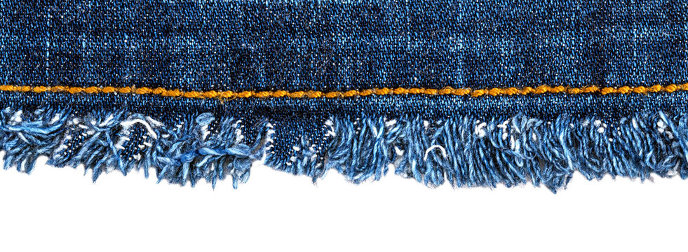 Denim fabric with frayed edges and yellow stitching displayed on a white background