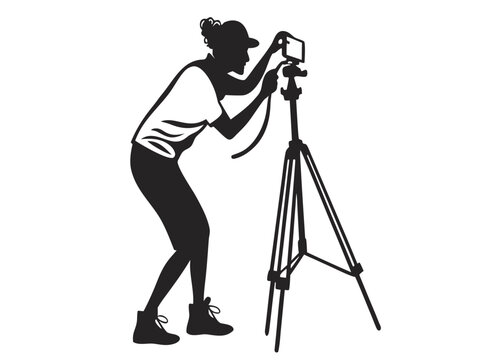 Creative female videographer silhouette capturing content with a camera on a tripod showcasing modern digital media creation and vlogging in a clean isolated studio setting