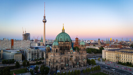 Berlin Cathedral (Berliner Dom) drone view with Berlin TV Tower on the background, during sunset. Berlin, Germany. © Cirrus Height
