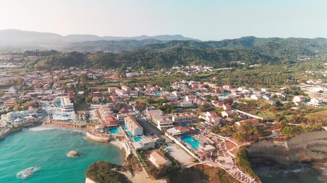 Aerial Pan Over Sidari Coastal Town and Ionian Sea Beaches in Corfu Greece
