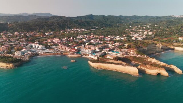 Aerial Sunrise Pan Over Sidari Coastal Cliffs Sea Caves and Ionian Sea Beaches in Corfu Greece