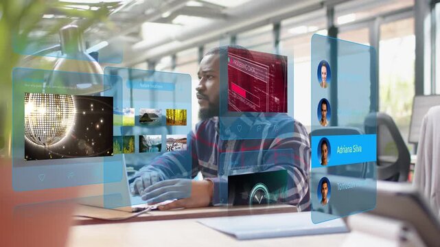 Man typing, glancing right, causing holo panels around him cycling DNA, map, clock for tech work