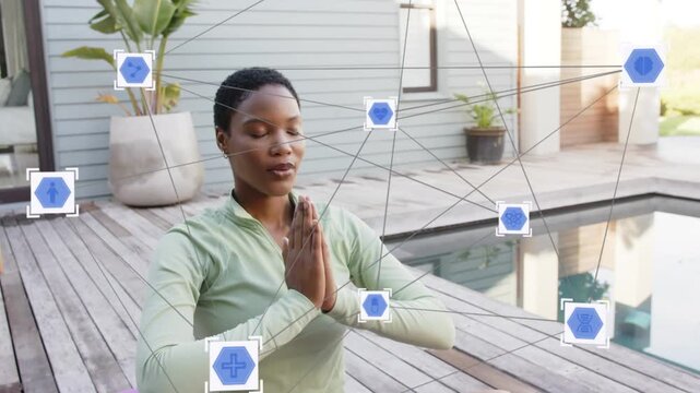 Woman practicing wellness on purple mat by pool, bringing then lowering palms, blue hexes anchoring