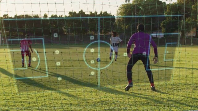 Keeper bracing in soccer goal while striker closing, motion causing HUD tracking ball to aid save