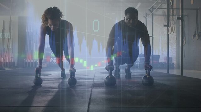 Two athletes training KB pushups lowering chests on gym floor, animated fitness chart pulsing above