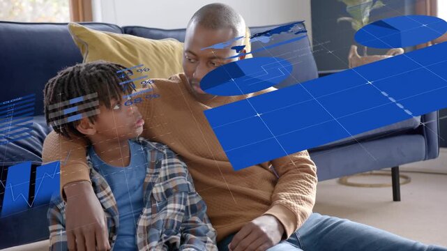 Father and son sitting on floor demoing tech while boy speaking causing blue HUD grids sweeping