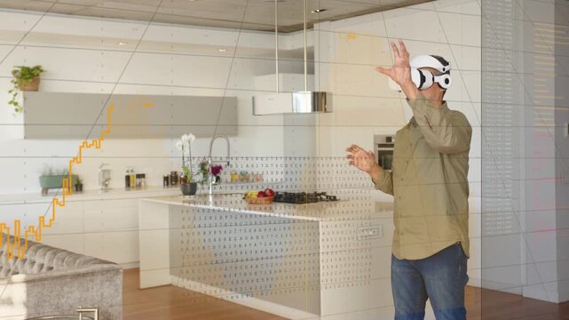 Man in kitchen demoing VR tech reaching to summon swiping hologram waveform graphs analyzing data