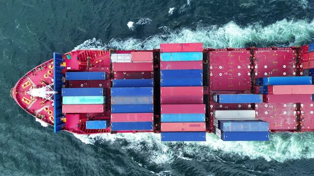Cargo container Ship, cargo maritime ship with contrail in the ocean ship carrying container and running for export concept technology freight shipping sea freight by Express Ship. top view