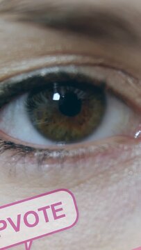 Vertical video: Woman's eye holding while pink UPVOTE or CHAT sliding in causing blink for marketing