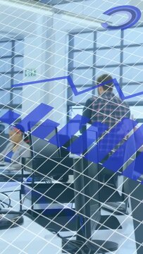 Vertical video: Plaid man walking aisle while staff lifting screen revealing blue tech data overlay