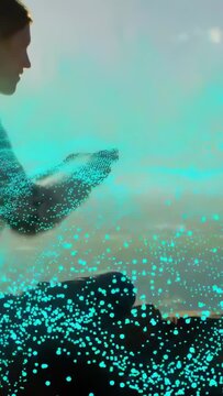 Vertical video: Woman sitting lifting arms with teal dots rising forming mesh around arms for tech