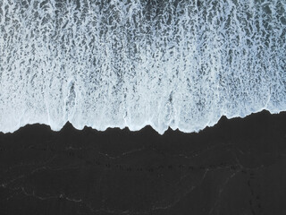 black sand beach, aerial view, ocean waves, azores, sao miguel, minimalist, volcanic, top down, portugal, contrast. © Oleksandr Fursa