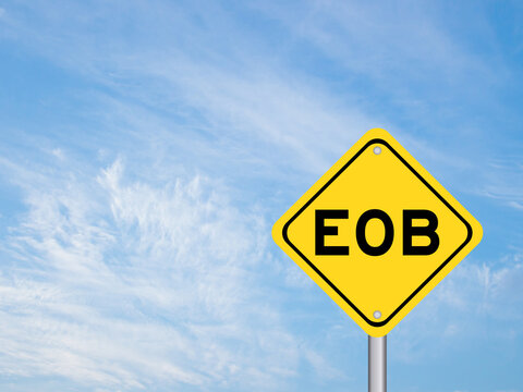 Yellow transportation sign with word EOB (Abbreviation of end of business) on blue color sky background