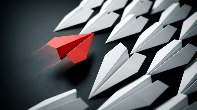 Solitary red paper plane breaking away from a group of white aircraft on dark background symbolizing leadership courage innovation and unique individuality for business success and breakthrough.