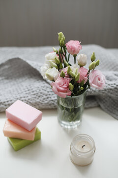 top view of natural decorated homemade soap with flowers on white surface. spa organic soap. Natural vegan soap with rose fragrance