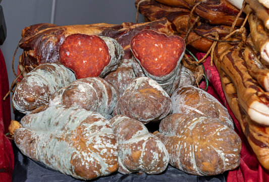 Traditional cured dry organic meat salami outside on local market