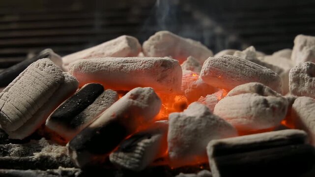 Closeup View Of Hot Glowing Charcoal Briquettes Emitting Radiant Heat For Outdoor Grilling Scenes