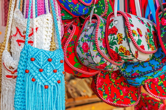 Background with bags embroidered and decorated with specific patterns of the Maramures area, Romania, exposed for sale at one traditional fair.